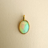 AAA ETHIOPIAN OPAL – charm – 18 K gold